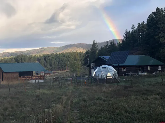 a view of a terrace with yard and outdoor seating