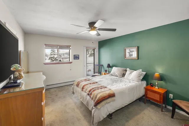 a bedroom with a bed and a television in it