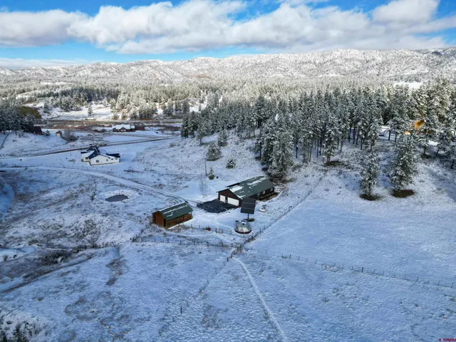 a view of a backyard of the house