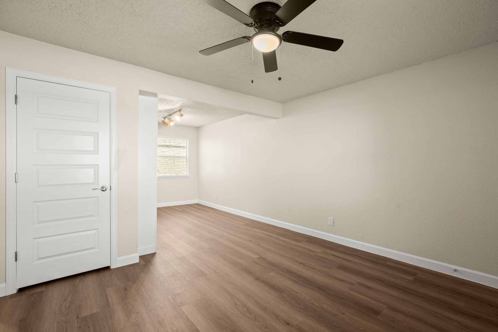 2408 Longview Street, Unit 112 Austin, TX 78705 - Photo 7 of 15 an empty room with wooden floor closet and ceiling fan