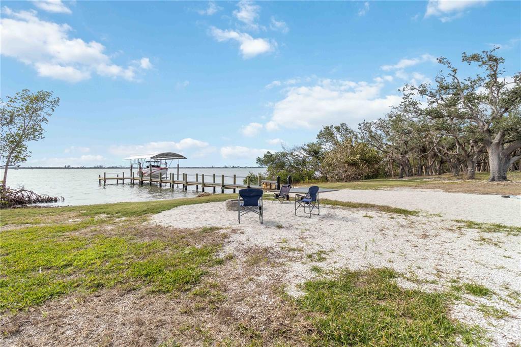 12350 Placida Road Placida, FL 33946 - Photo 2 of 17 a view of a lake with houses