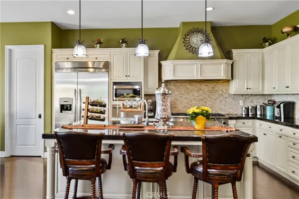 a dining room with furniture window and wooden floor