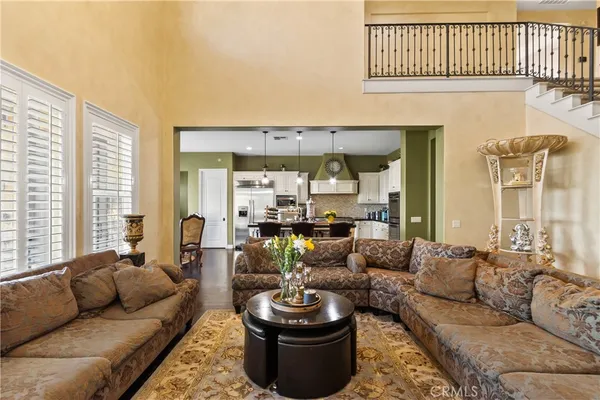 a view of staircase with lots of frames and a wooden floor