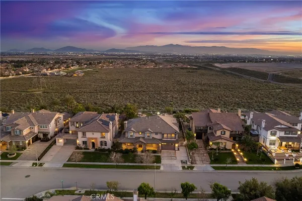 an aerial view of houses with yard