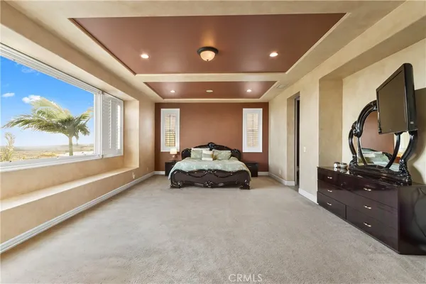 a view of a balcony with chair and wooden floor