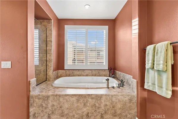 a bathroom with double vanity sinks and a mirror