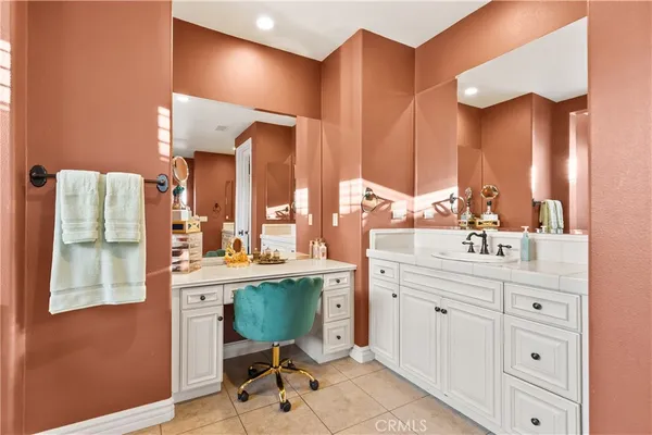 a dining room with furniture and a floor to ceiling window