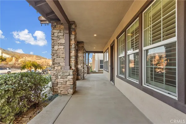 a very nice looking room with wooden floor and furniture
