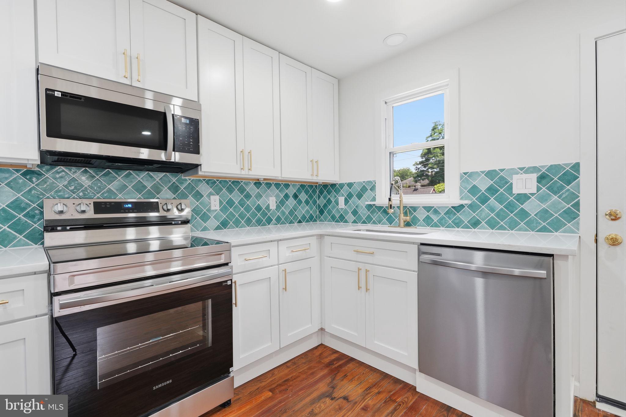124 Cedar Road Riegelsville, PA 18077 - Photo 15 of 50 Modern kitchen with stylish tiles.