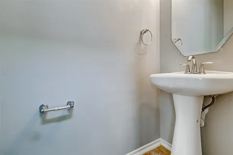a bathroom with a sink and mirror