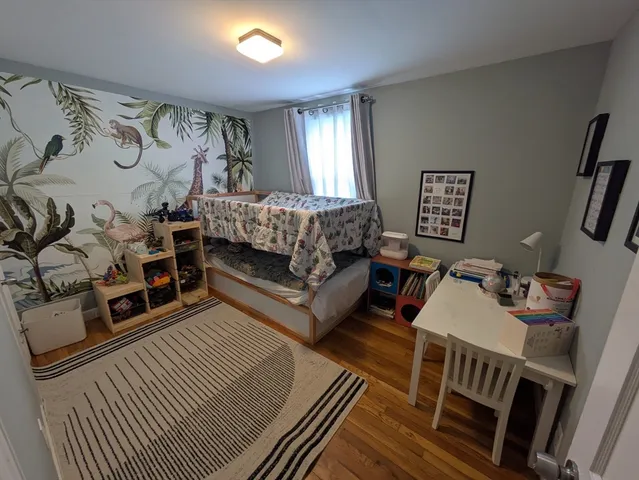 a bedroom with furniture and a window