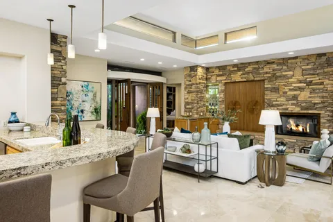 a lobby with furniture and window