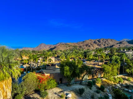 a view of a dining hall with furniture and chandelier