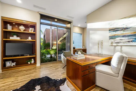 a view of a swimming pool and lounge chair