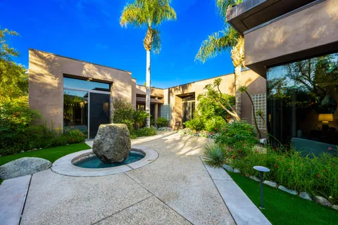 a living room with furniture and flat screen tv