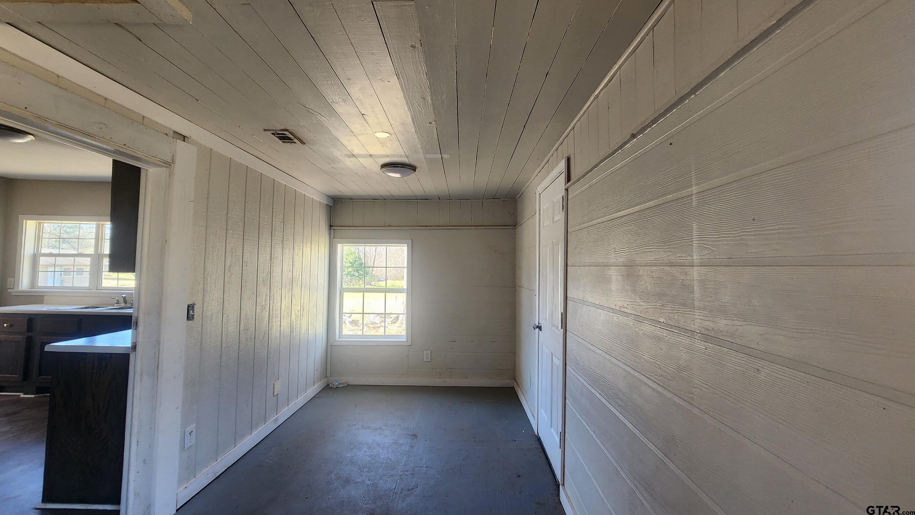 104 Carson Street Pittsburg, TX 75686 - Photo 7 of 9 a view of hallway with window and stairs