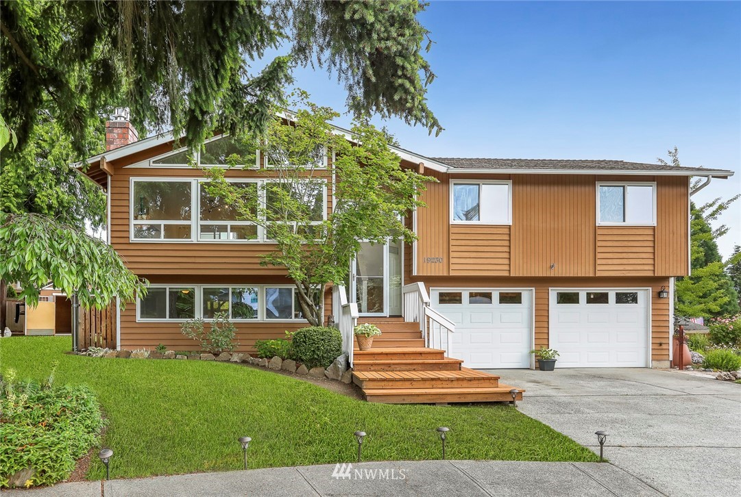 19230 90th Place Northeast Bothell, WA 98011 - Photo 1 of 40 a front view of a house with a yard