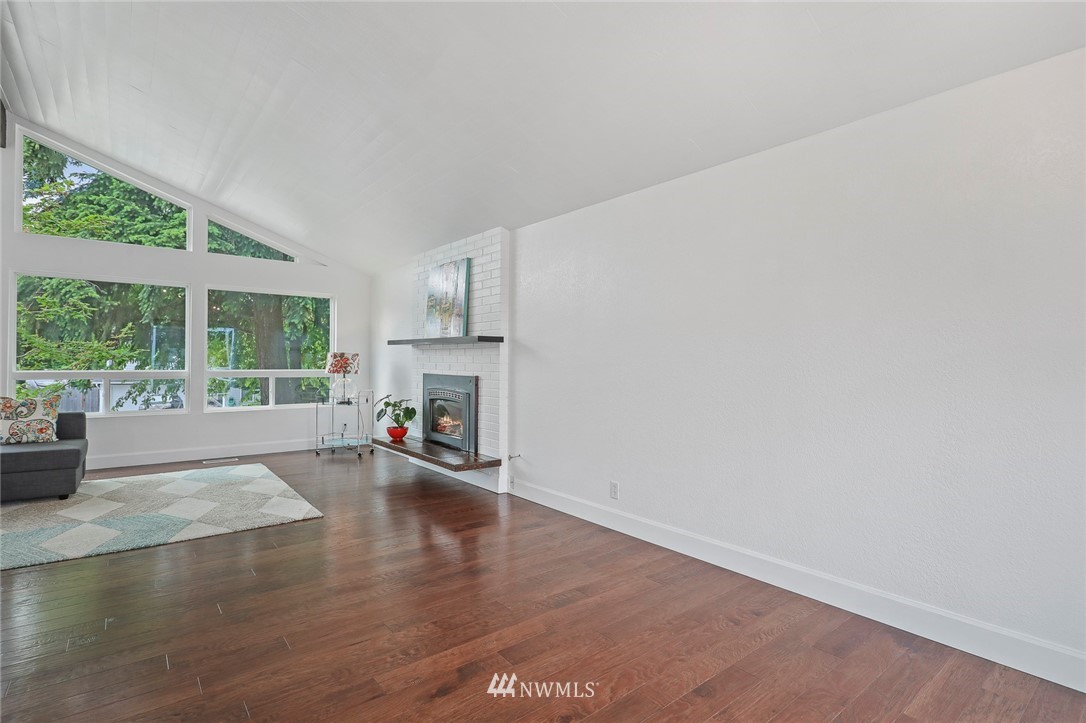 19230 90th Place Northeast Bothell, WA 98011 - Photo 11 of 40 an empty room with wooden floor and outdoor view