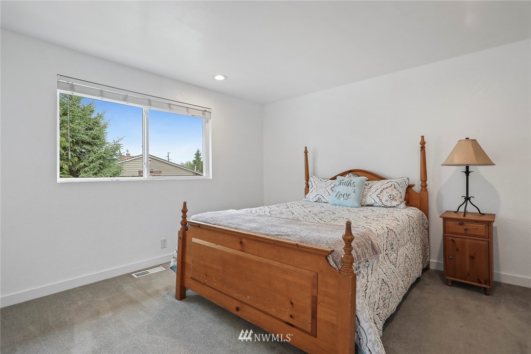 19230 90th Place Northeast Bothell, WA 98011 - Photo 14 of 40 a bedroom with a bed and a window