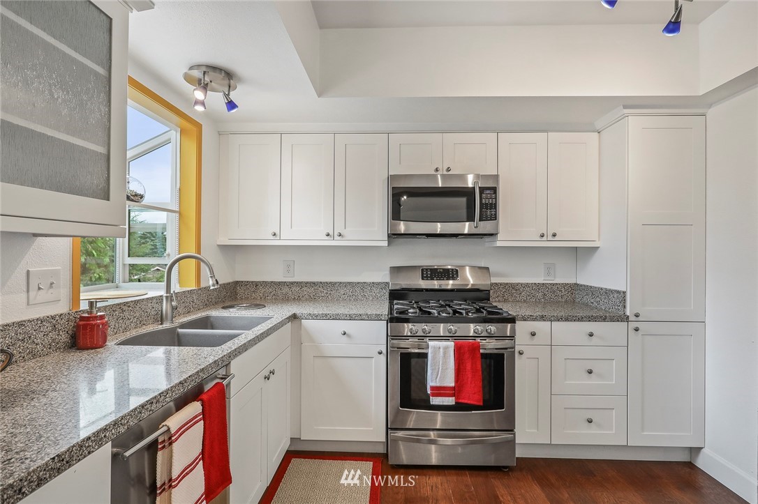 19230 90th Place Northeast Bothell, WA 98011 - Photo 3 of 40 a kitchen with stainless steel appliances granite countertop a stove and a sink