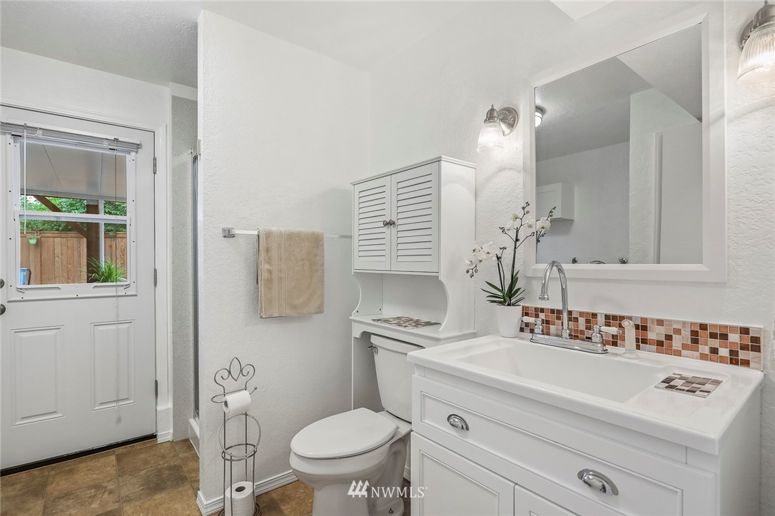 19230 90th Place Northeast Bothell, WA 98011 - Photo 21 of 40 a bathroom with a sink a toilet and mirror