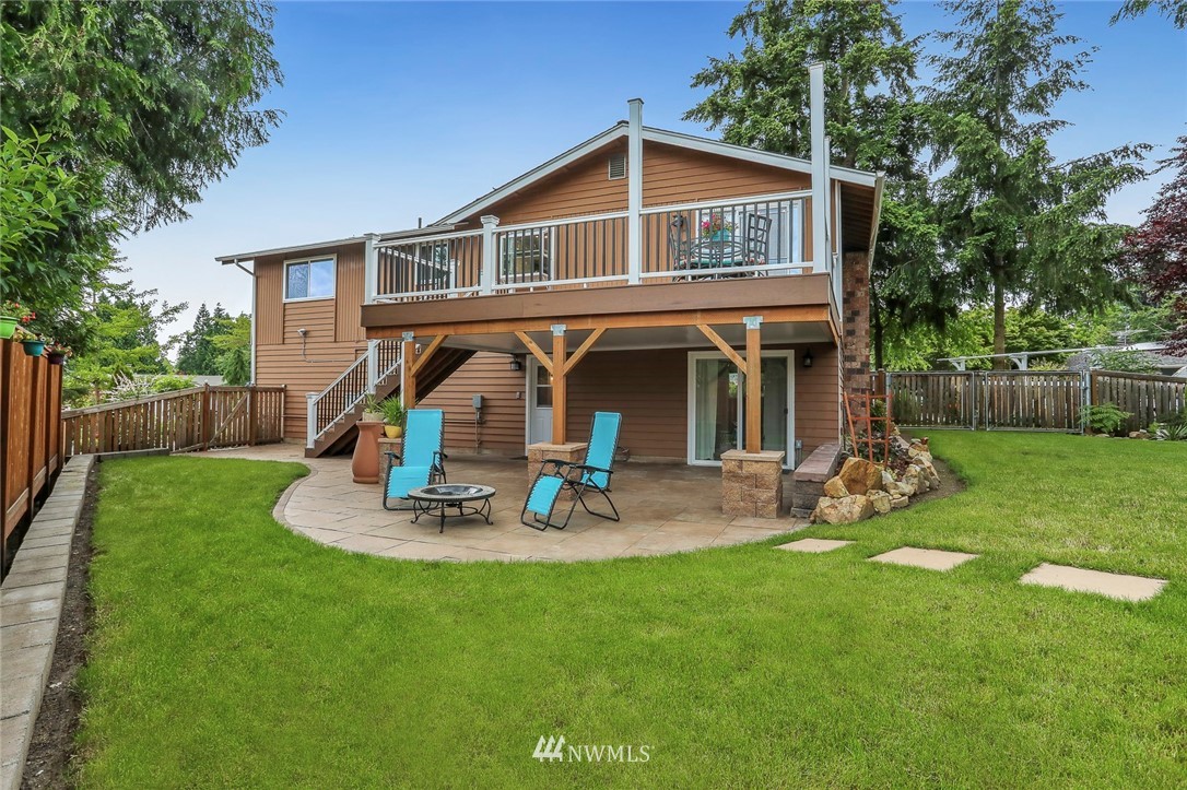 19230 90th Place Northeast Bothell, WA 98011 - Photo 27 of 40 a view of a house with a yard and sitting area