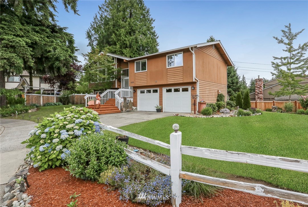 19230 90th Place Northeast Bothell, WA 98011 - Photo 29 of 40 a view of a house with a yard and sitting area