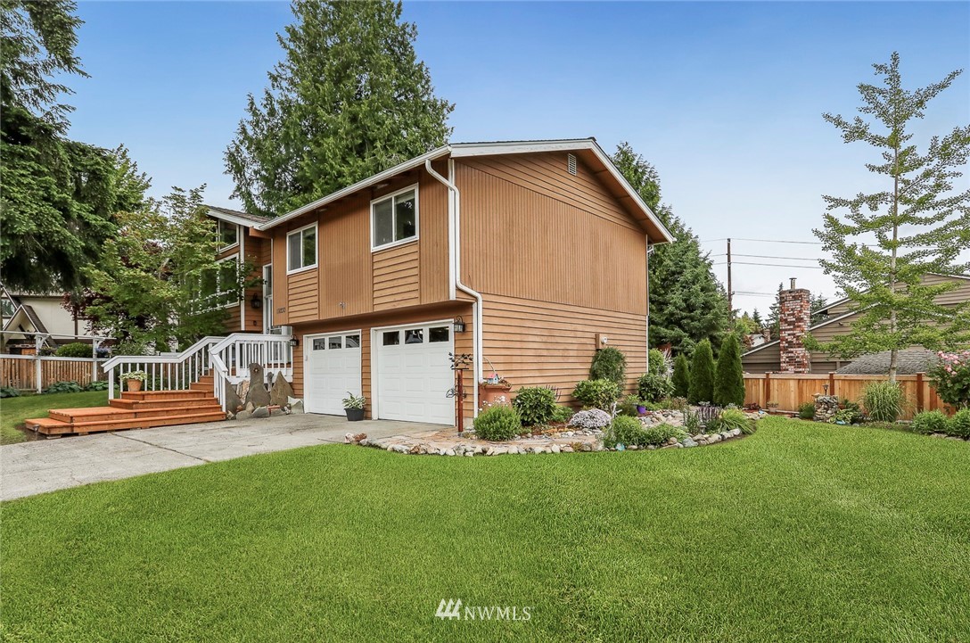 19230 90th Place Northeast Bothell, WA 98011 - Photo 30 of 40 a backyard of a house with table and chairs