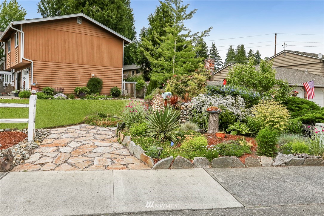 19230 90th Place Northeast Bothell, WA 98011 - Photo 32 of 40 a view of a house with a yard and plant