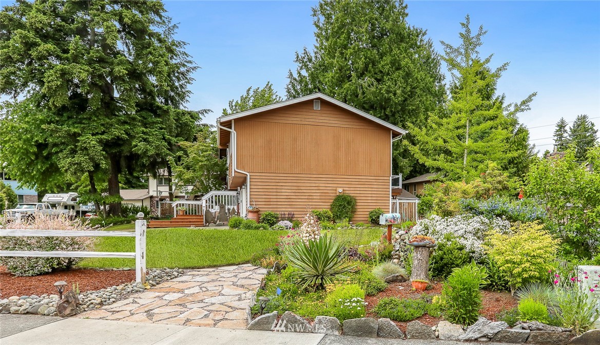 19230 90th Place Northeast Bothell, WA 98011 - Photo 33 of 40 a view of backyard of house with green space