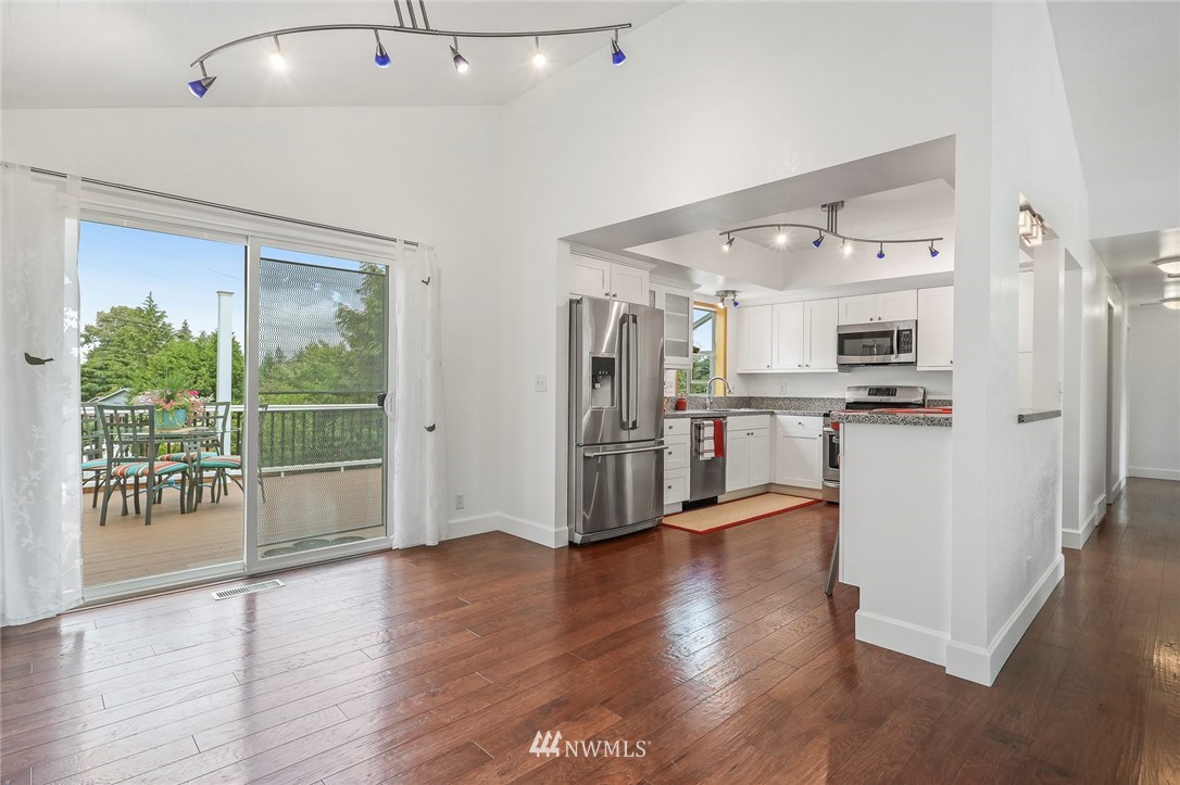 19230 90th Place Northeast Bothell, WA 98011 - Photo 10 of 40 a view of a kitchen with wooden floor and a window