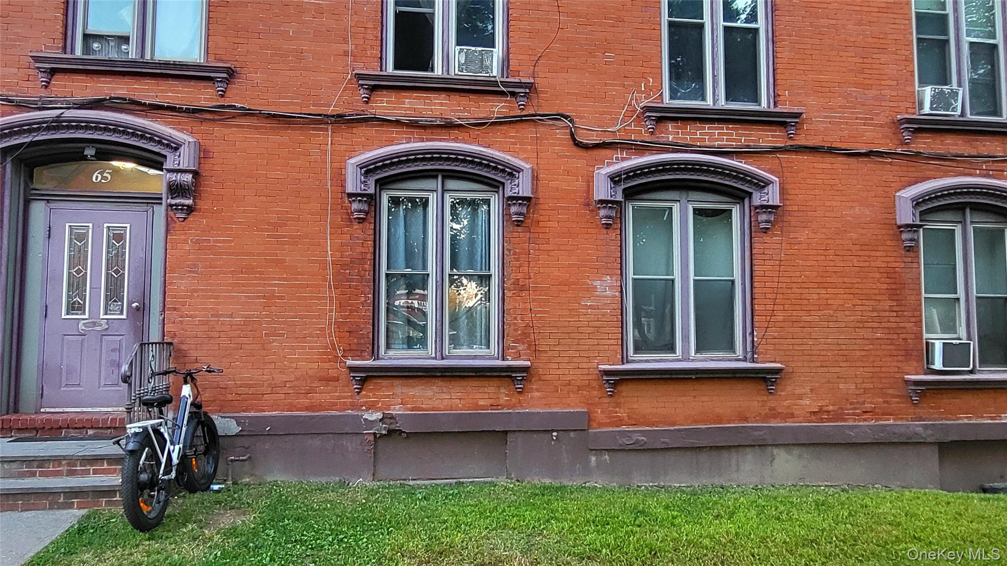 65 South Hamilton Street, Unit 9 Poughkeepsie, NY 12601 - Photo 2 of 20 front view of brick house with a large windows