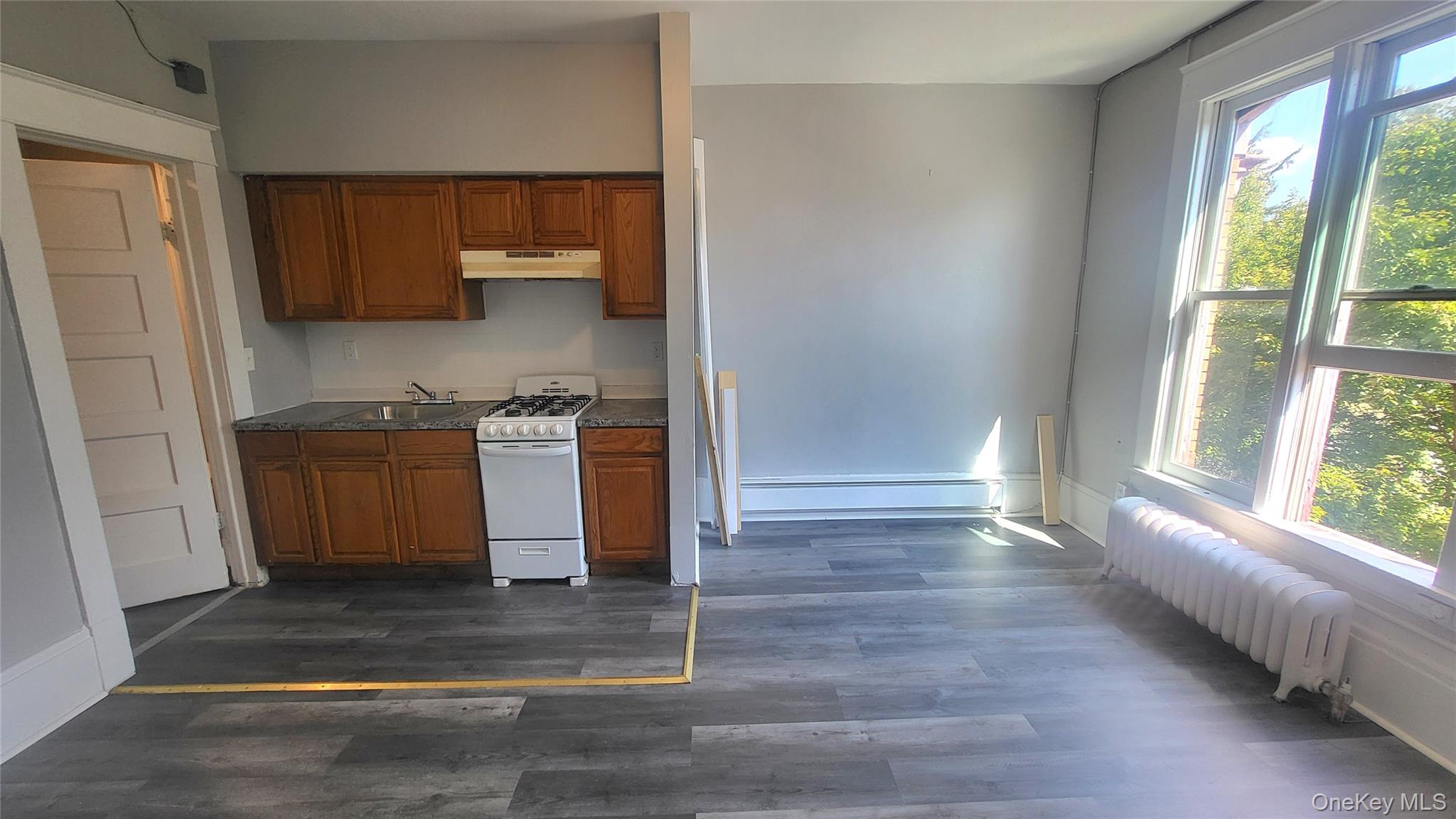 65 South Hamilton Street, Unit 9 Poughkeepsie, NY 12601 - Photo 6 of 20 a kitchen with stainless steel appliances granite countertop a stove a sink and a refrigerator