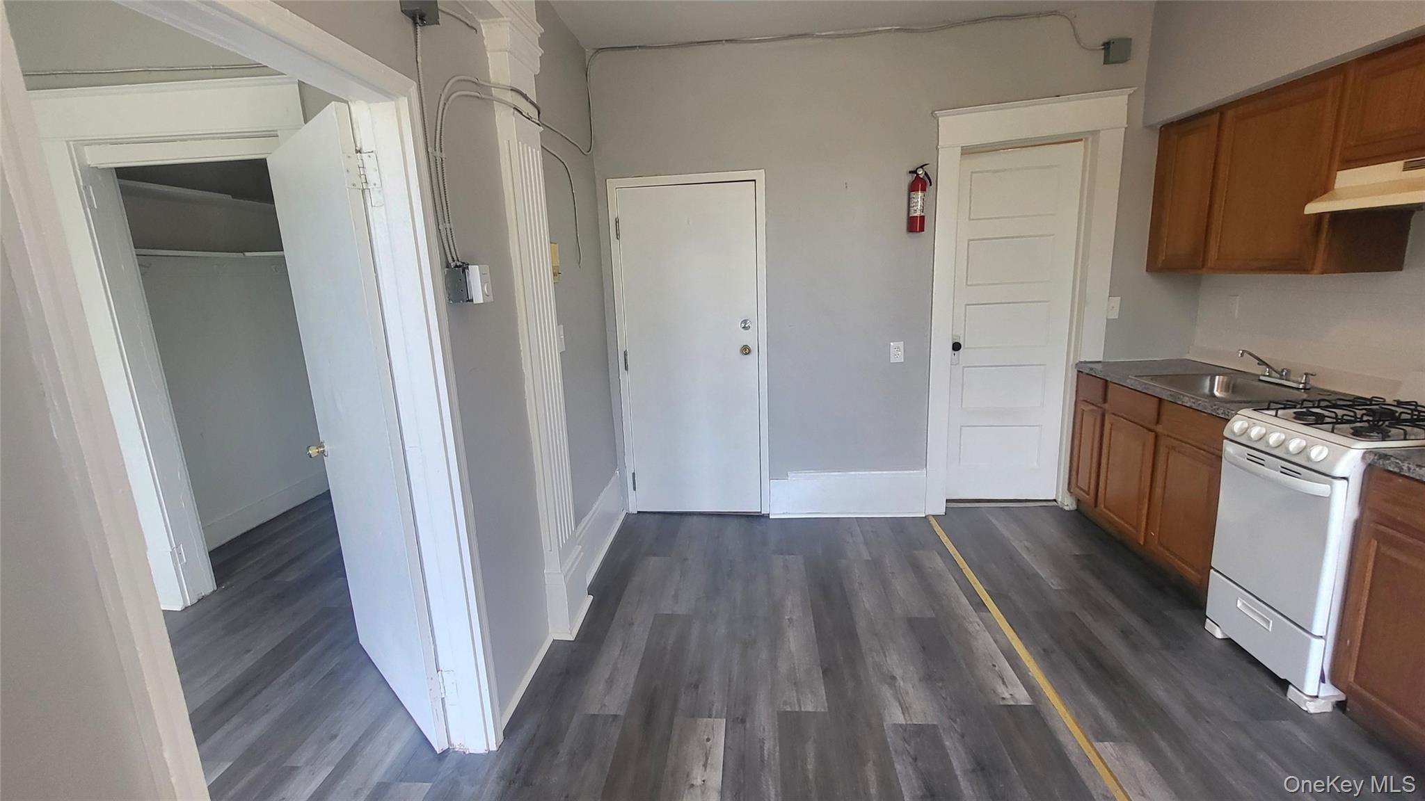 65 South Hamilton Street, Unit 9 Poughkeepsie, NY 12601 - Photo 7 of 20 a view of a kitchen from a hallway