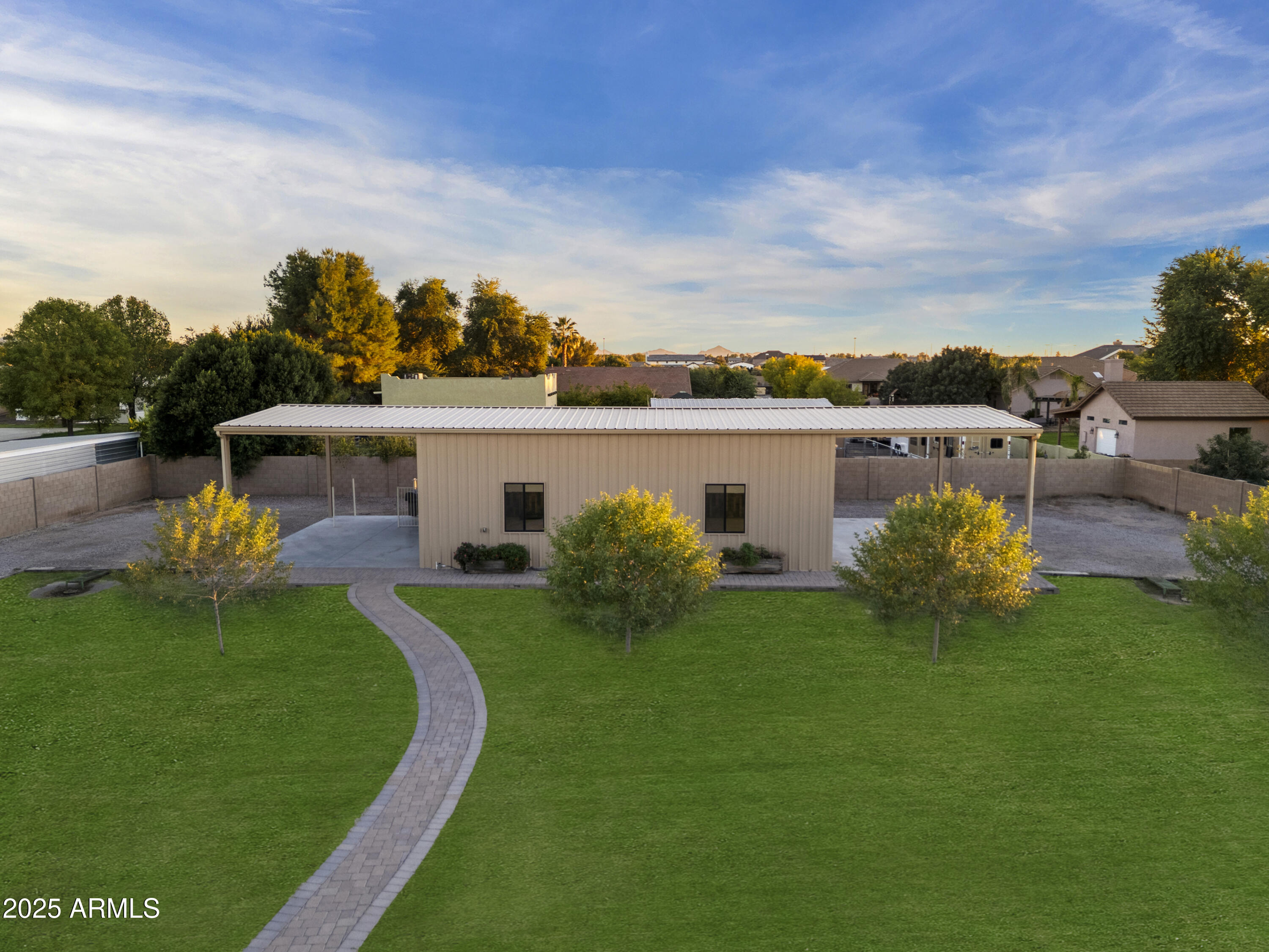 2667 East Melrose Street Gilbert, AZ 85297 - Photo 24 of 32 a view of a house with a big yard