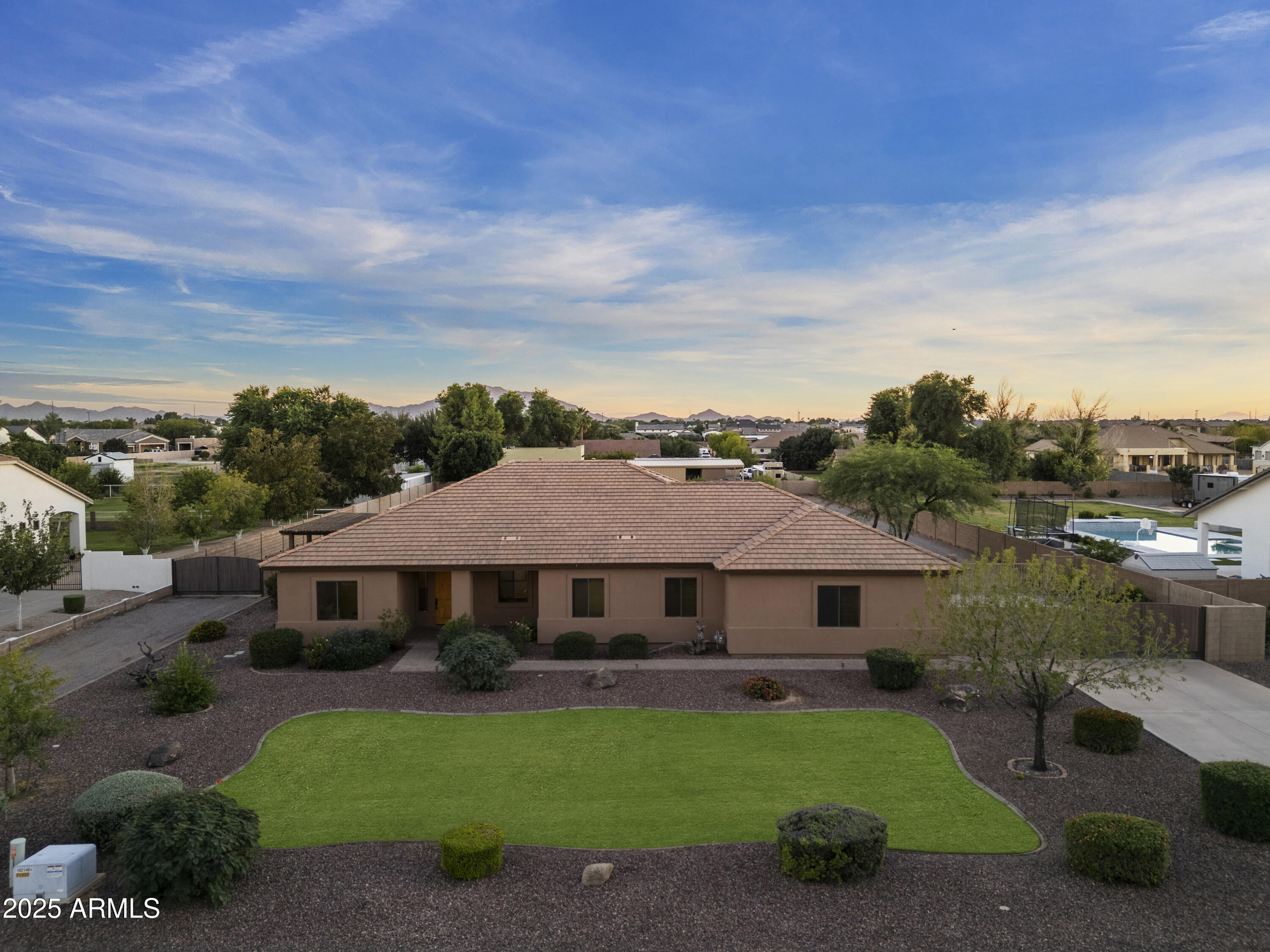 2667 East Melrose Street Gilbert, AZ 85297 - Photo 2 of 32 a aerial view of a house next to a yard
