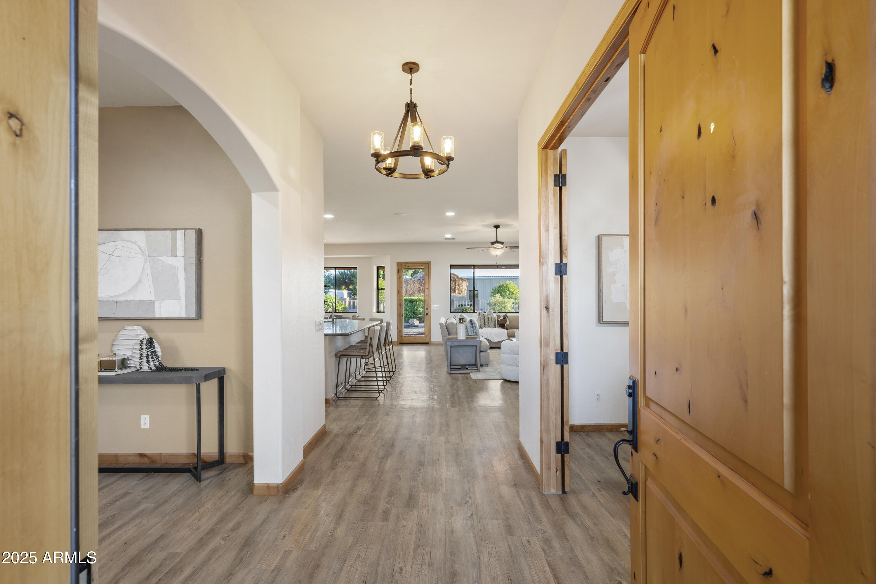2667 East Melrose Street Gilbert, AZ 85297 - Photo 4 of 32 a view of a livingroom with furniture hardwood floor and hallway