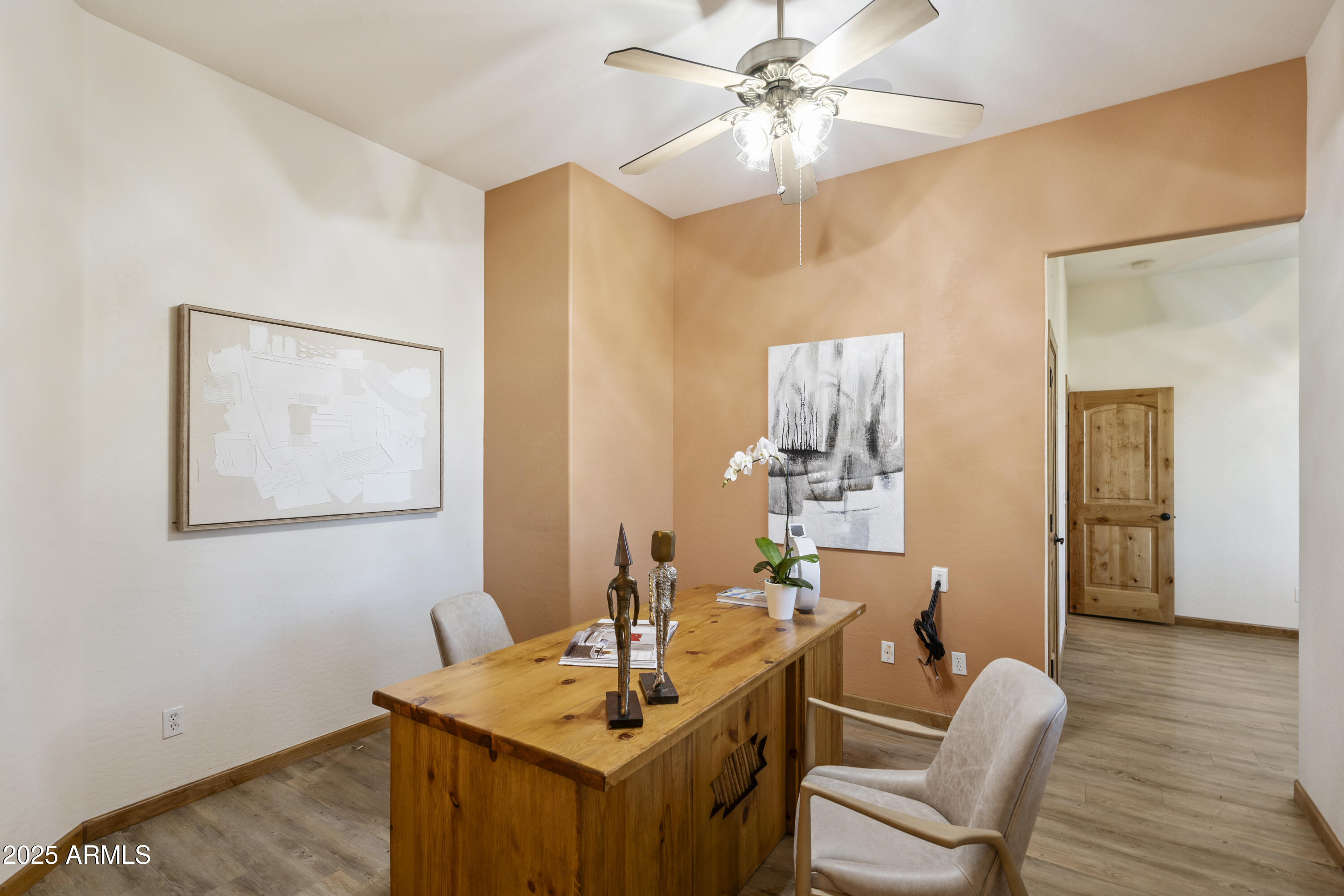 2667 East Melrose Street Gilbert, AZ 85297 - Photo 6 of 32 a dining room with wooden floor and chandelier