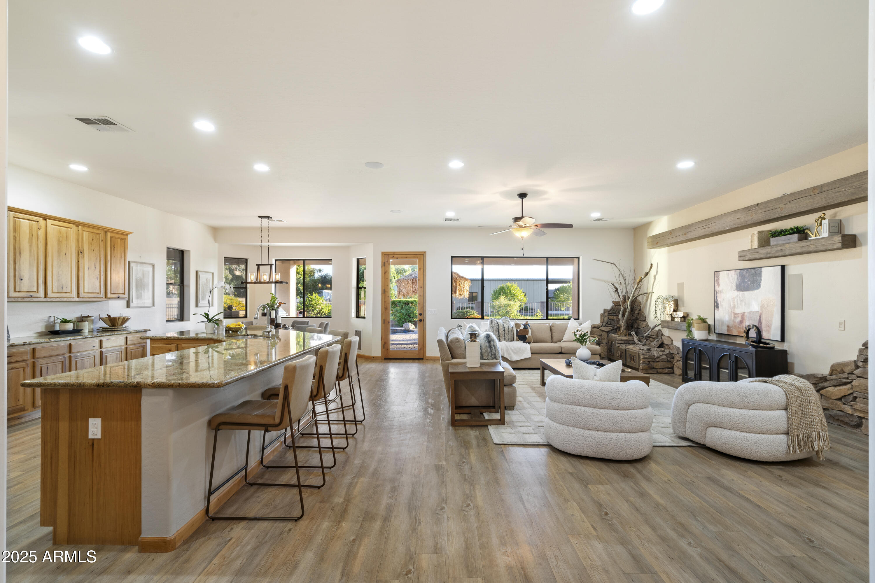 2667 East Melrose Street Gilbert, AZ 85297 - Photo 7 of 32 a living room with furniture and a large window