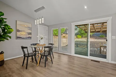 a view of a dining room with furniture window and outside view