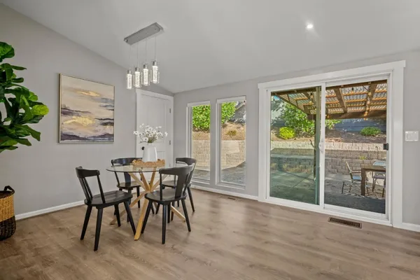 a view of a dining room with furniture window and outside view