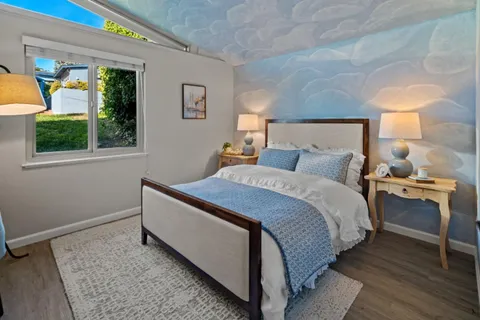 a bedroom with bed and window