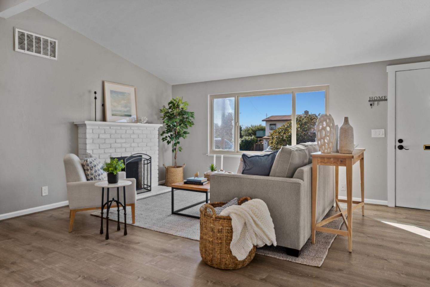 1148 San Lucas Street Seaside, CA 93955 - Photo 2 of 27 a living room with furniture and a fireplace