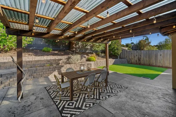 a view of yard with patio