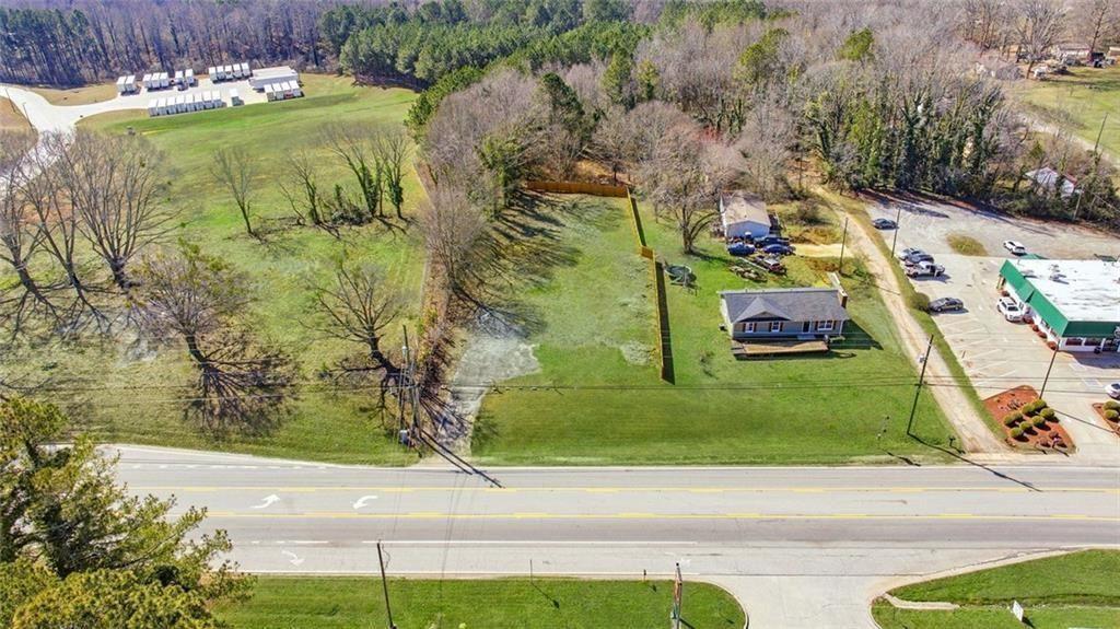 5323 Thompson Bridge Road Murrayville, GA 30564 - Photo 3 of 33 an aerial view of a house with a garden and yard