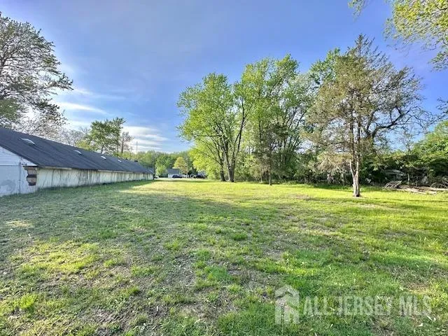 a view of outdoor space with deck and yard