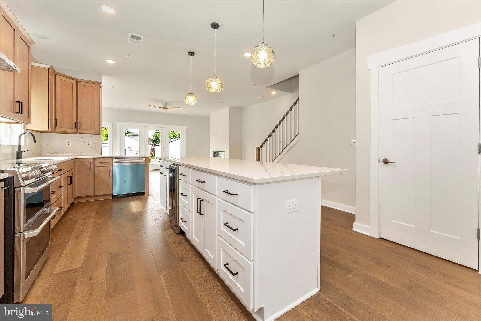 328 Madison Street Frederick, MD 21701 - Photo 11 of 49 a kitchen with white cabinets and white appliances
