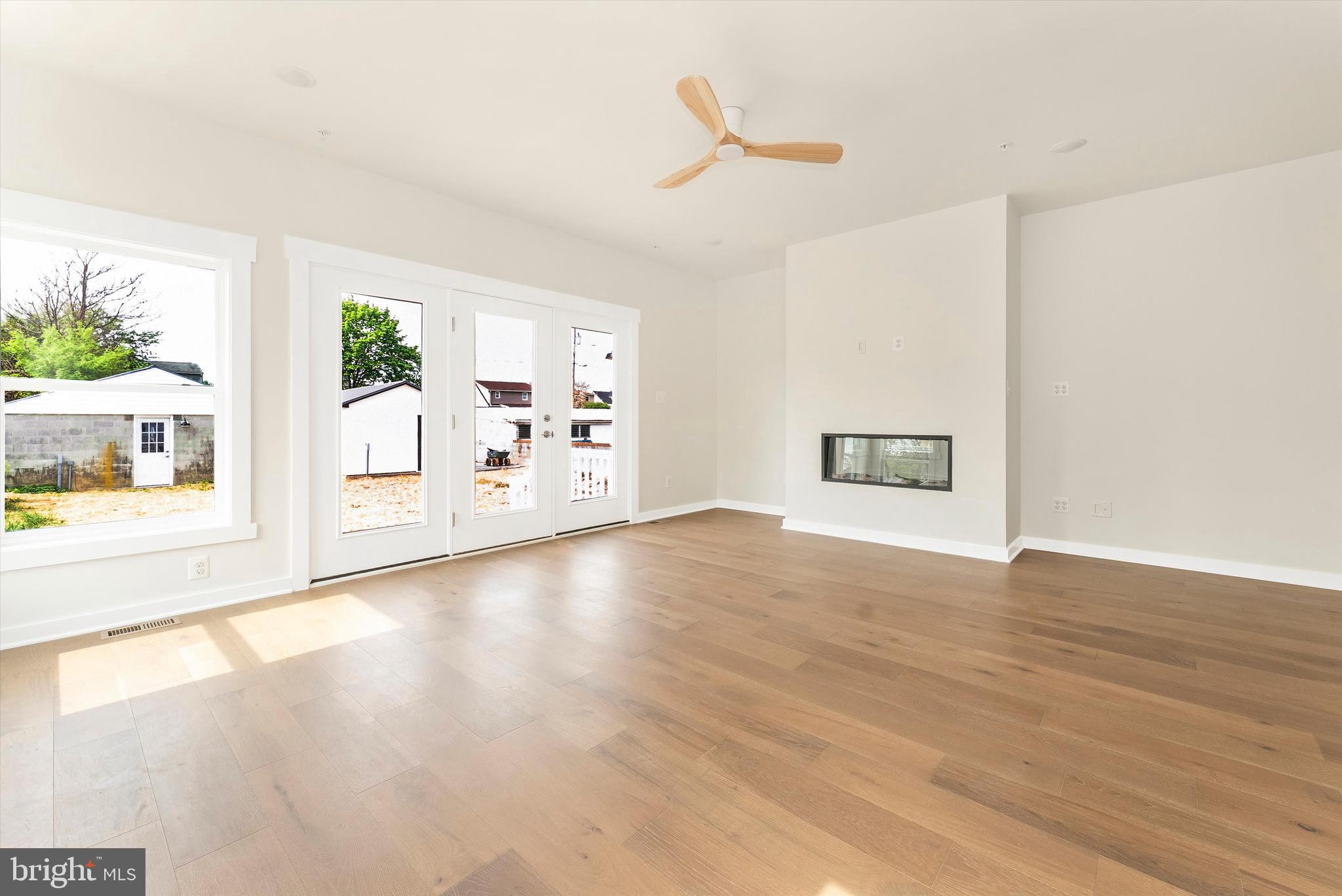 328 Madison Street Frederick, MD 21701 - Photo 18 of 49 a view of empty room with wooden floor and fan