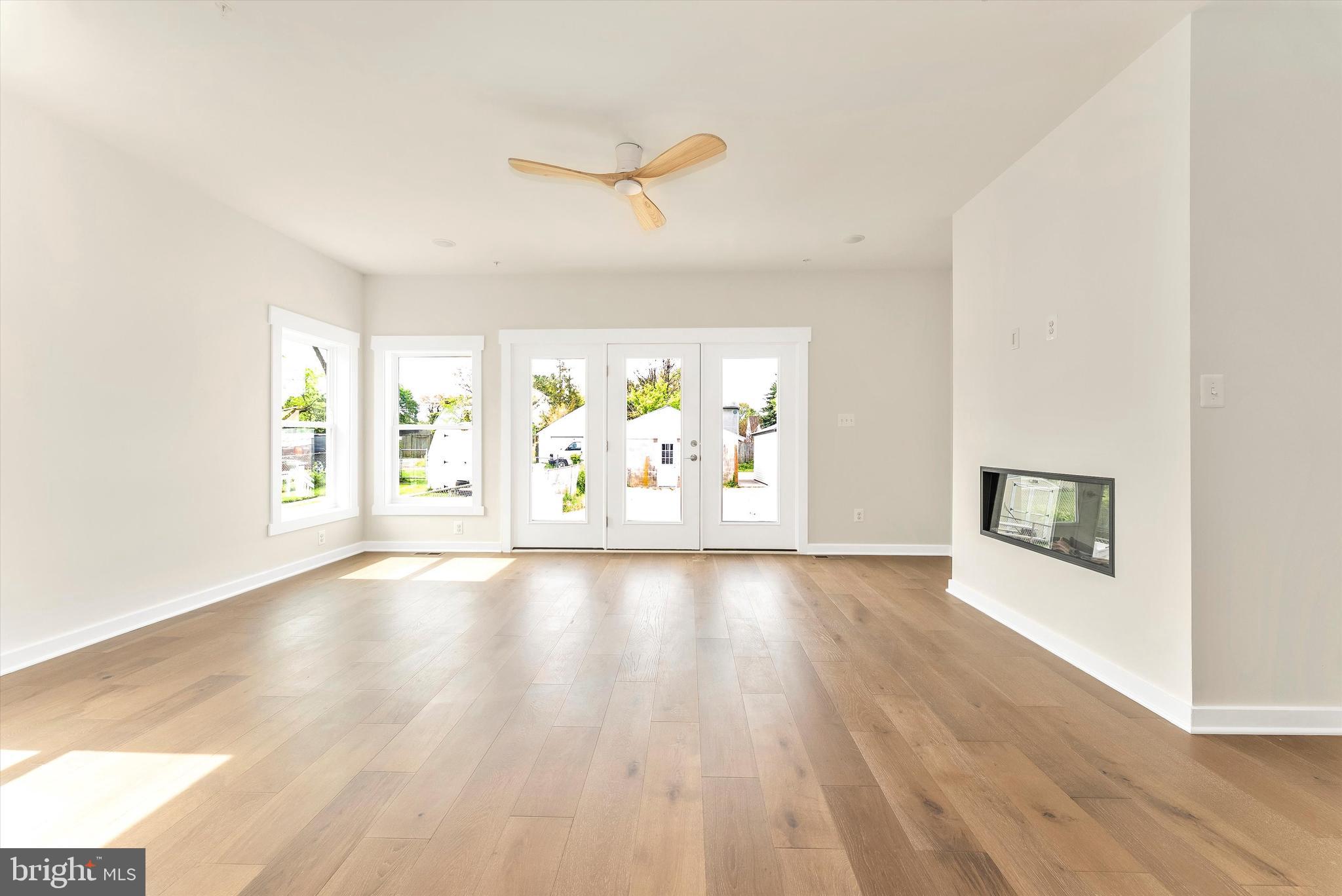 328 Madison Street Frederick, MD 21701 - Photo 19 of 49 wooden floor in an empty room with a window