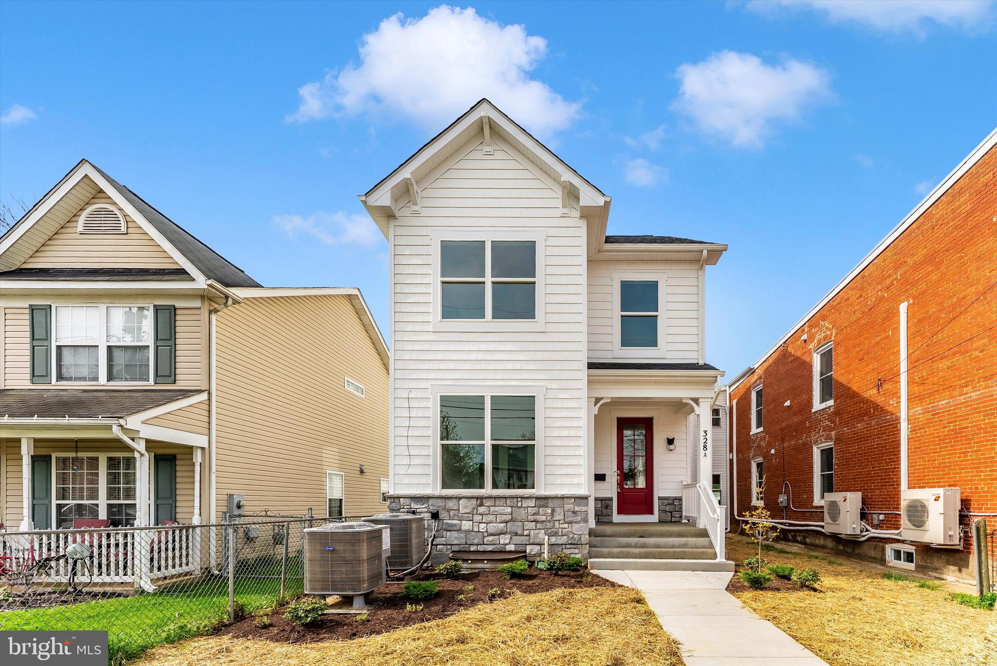 328 Madison Street Frederick, MD 21701 - Photo 2 of 49 a front view of a house with a yard